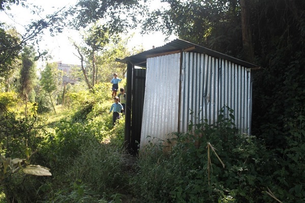 Student running to temporary latrine during break